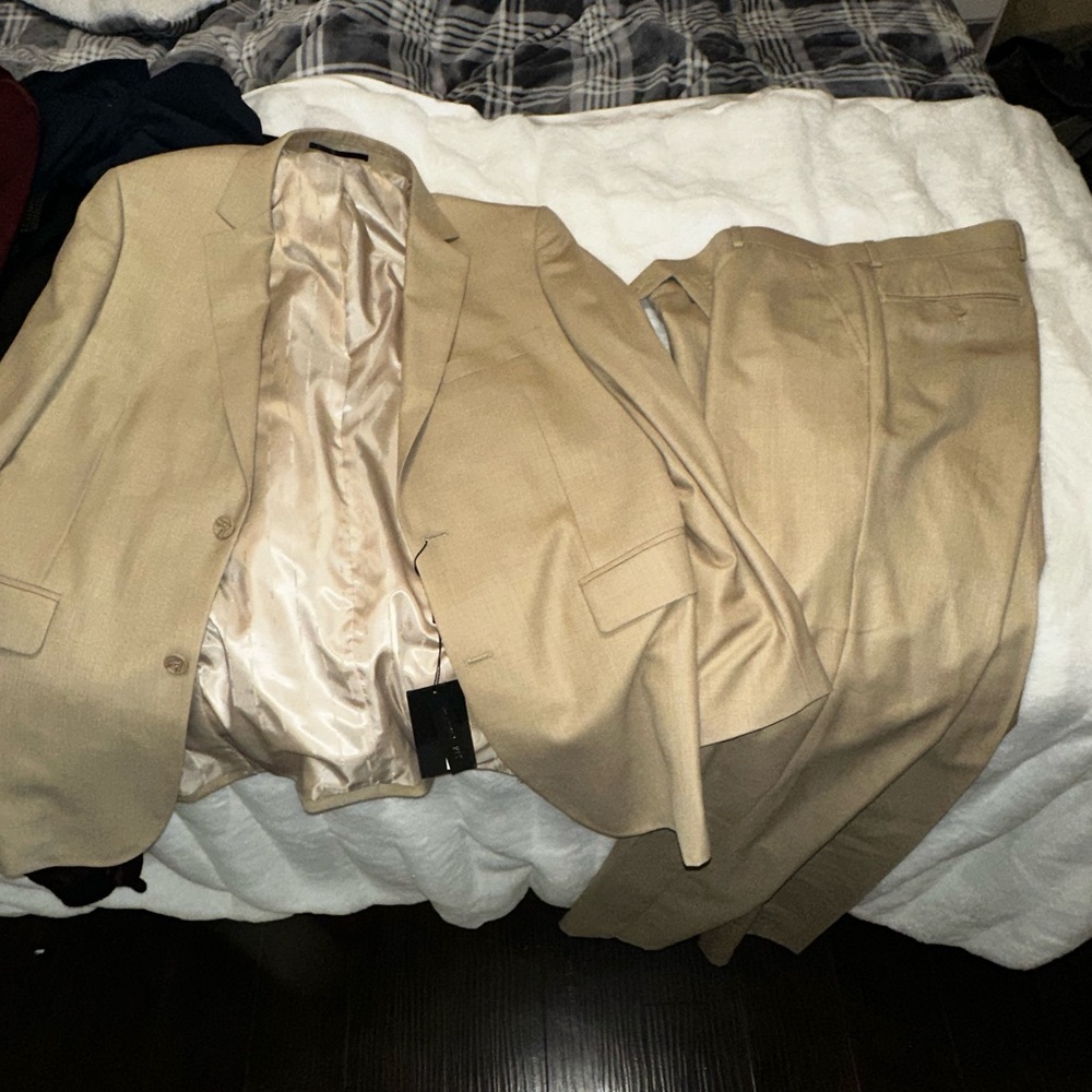 Tan suit never used !